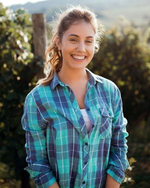 woman-winemaker-with-grapes-in-a-vineyard-Y3S6K8Z.jpg